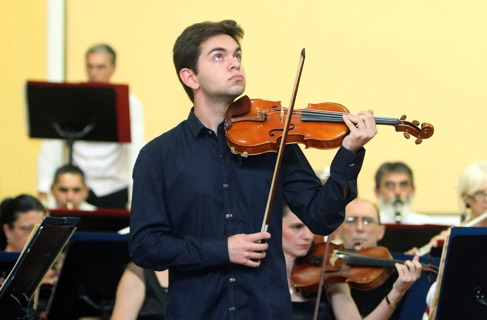 David Kurtic performing as a violin soloist with orchestra